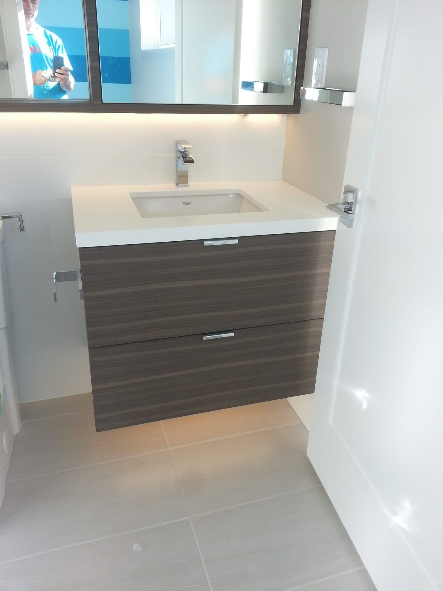 Bathroom vanity cabinet detail with modern hardware