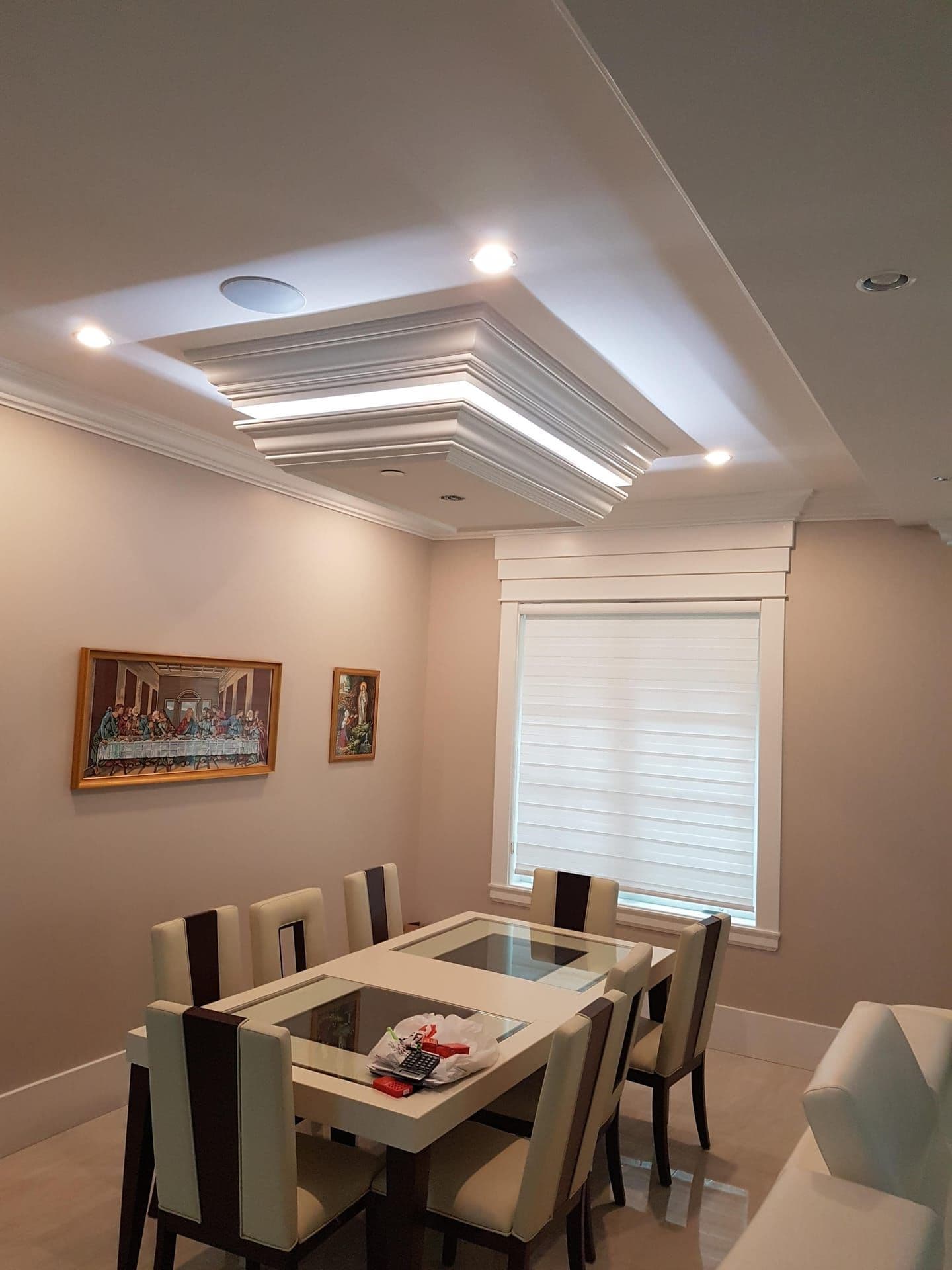 Dining room with recessed lighting and wainscoting