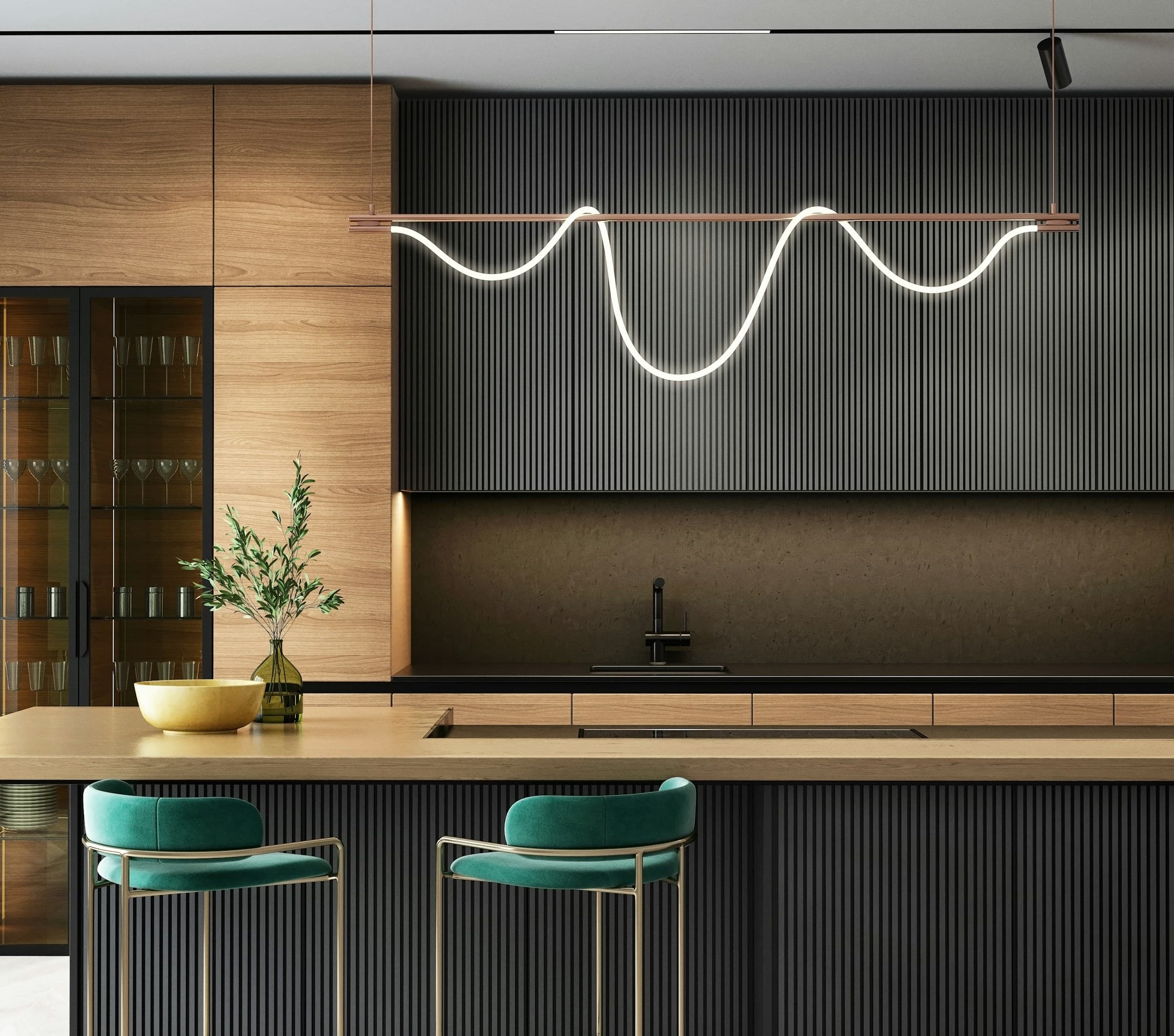 A dark, sculptural kitchen with walnut and integrated lighting